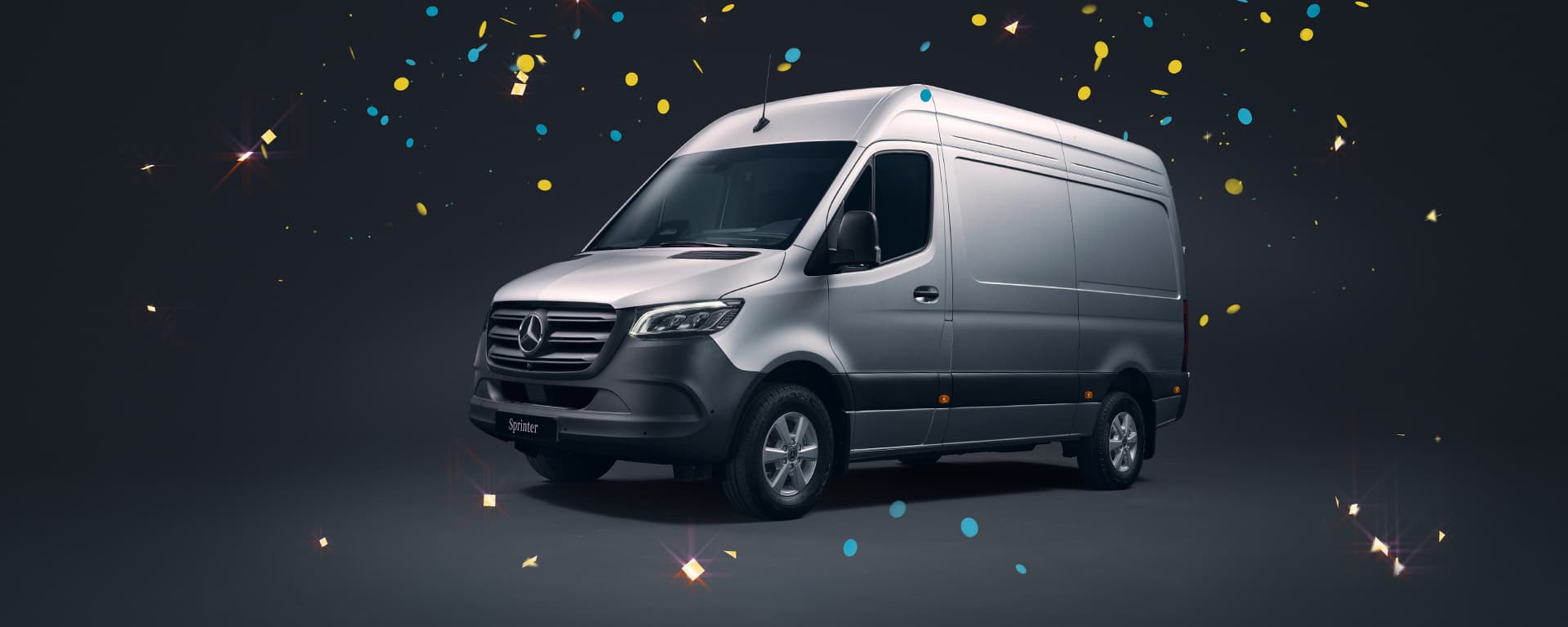 Ein silberner Mercedes-Benz Sprinter vor einem dunklen Hintergrund. Es regnet Konfetti.