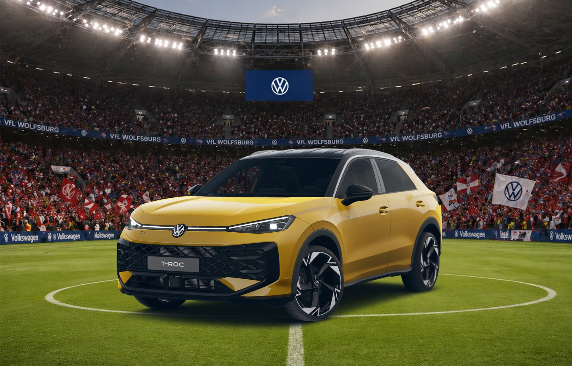 Gelber VW T-Roc im Fußballstadion unter Flutlicht.